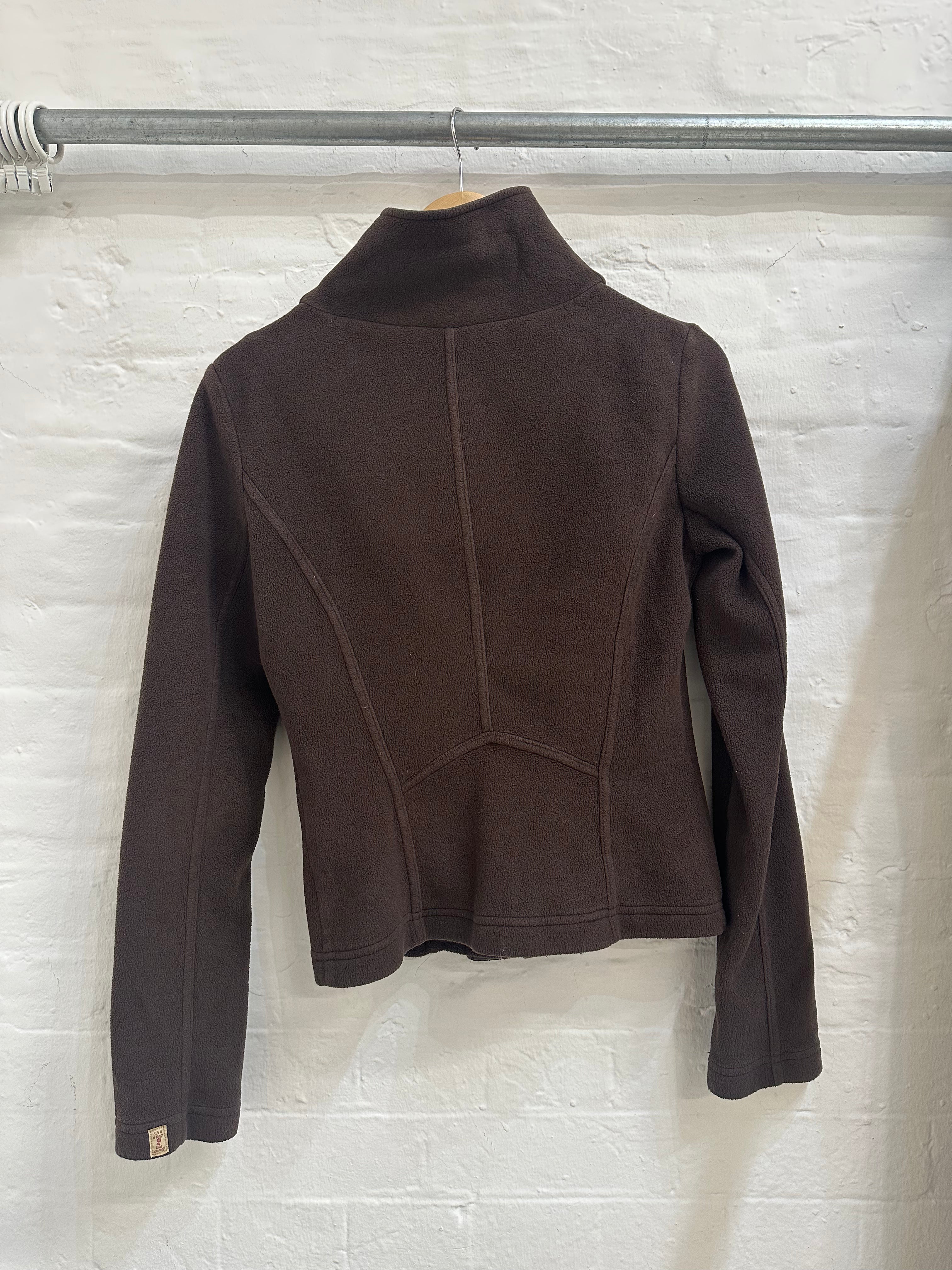 fleece jacket with an asymmetrical buckles